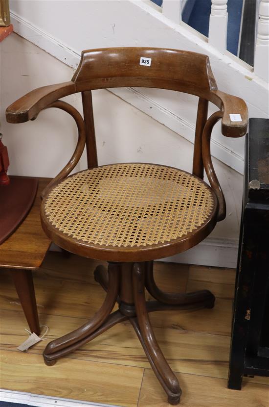 A bentwood and canework swivel desk chair